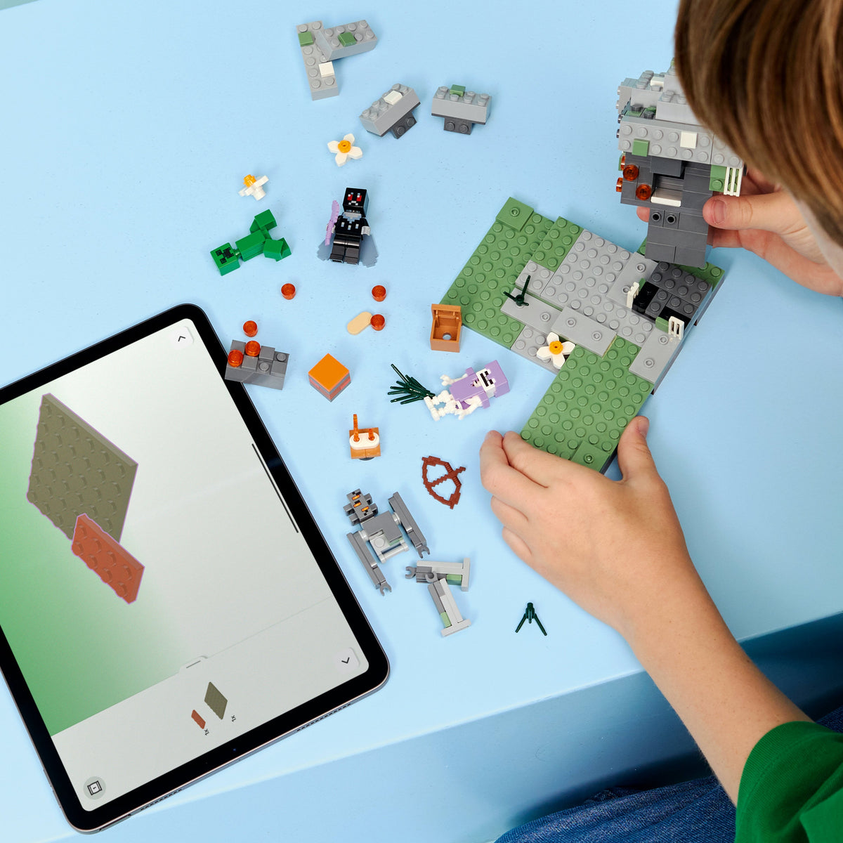 Child building LEGO 21586