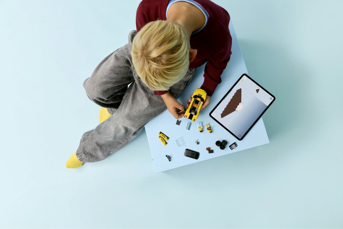 Child building LEGO 60487
